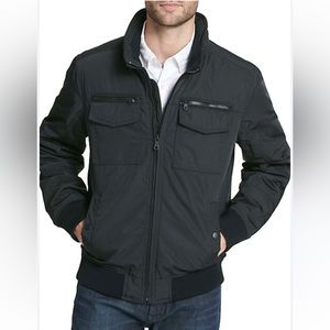 NWOT. Tommy Hilfiger extreme cold winter coat . Dress up/down.Tons of storage .